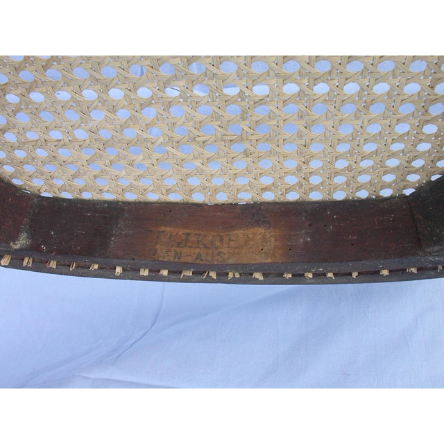 Single chair, hot-stamped by J & J Kohn, Vienna, Austria. Both the frame and the cane are in excellent condition. This...