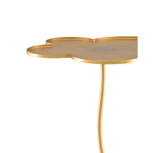 The Fleur Large Gold Accent Table is made of iron in a lustrous gold leaf finish. It takes talent to create whimsical...