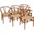 Set of 6 Hans Wegner Wishbone chairs, model CH24, with frames of lacquered cherry wood and seats of natural paper cord....