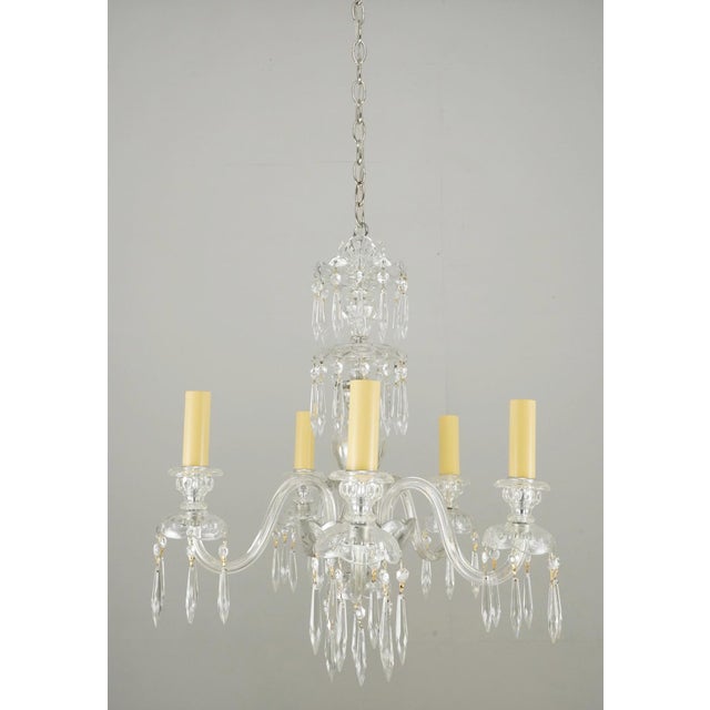Traditional style crystal chandelier with curved glass arms and spear shaped crystals. The chain is made of polished...
