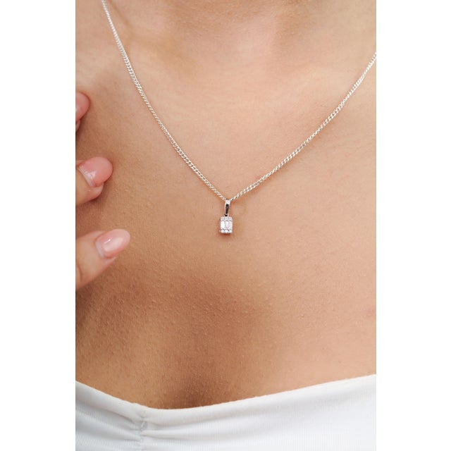 Elevate your jewelry collection with this elegant 14K solid white gold diamond pendant. Featuring three vertical baguette-...