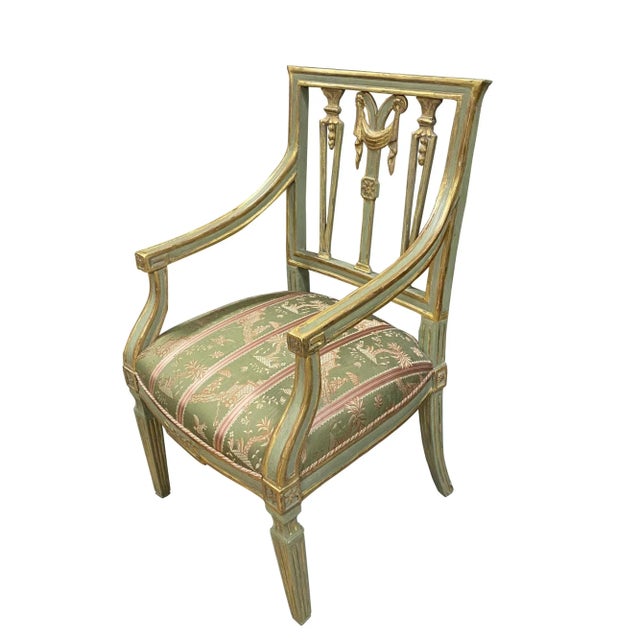 A fine late 18th Century Italian armchair with an open back with carved open work supports with swags. The arms transition...