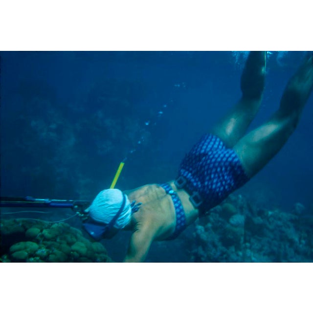 Speargun Fishing In Antigua by Toni Frissell A female diver speargun fishing in Antigua, 1961. (Photo by Toni Frissell)...