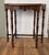 Antique side table featuring a striking octagonal top in richly figured burl walnut, with a molded edge and scalloped...