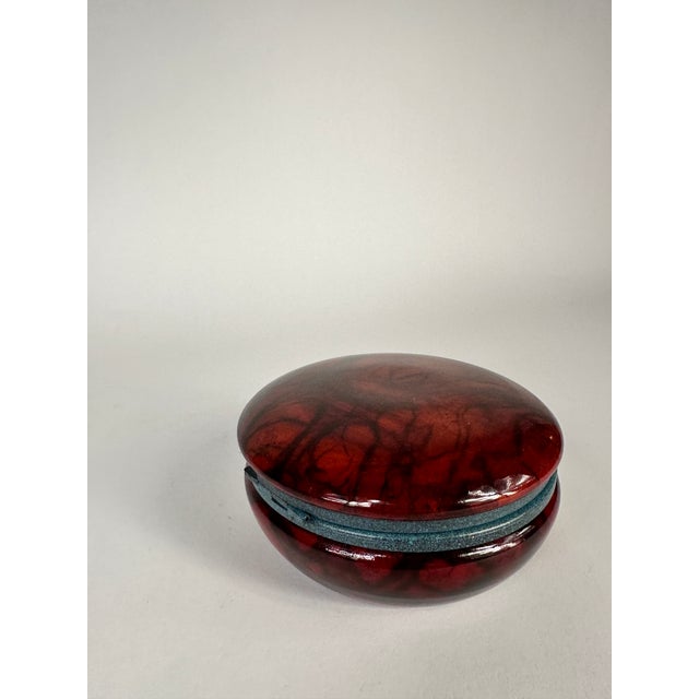 MCM hi ged round alabaster box from Italy. In a coloration ranging from brick red to burnt umber this is certainly an eye...
