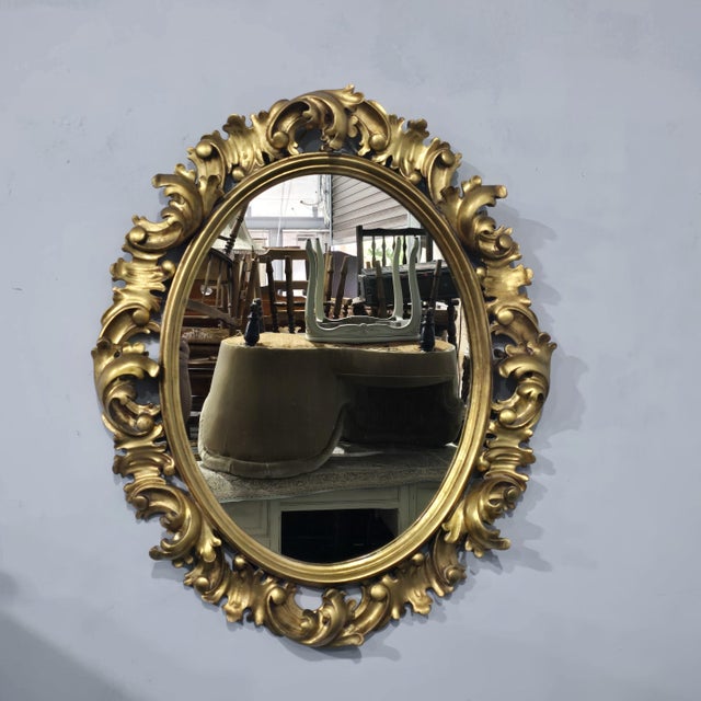 Fabulous Italian deep undercarved oval gilt mirror, with original plate glass, can be hung ladscape or portrait, in very...