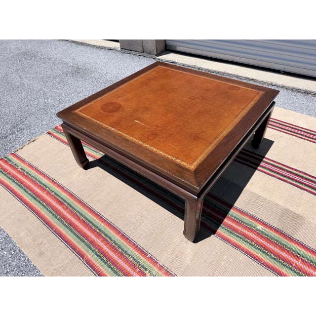 Vintage Baker Furniture Mahogany & Leather Chinoiserie Coffee Table, circa 1960s A handsome and well-proportioned cocktail...