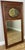 A beautiful Antique French polished mirror featuring a richly toned oak frame with elegant decorative floral...