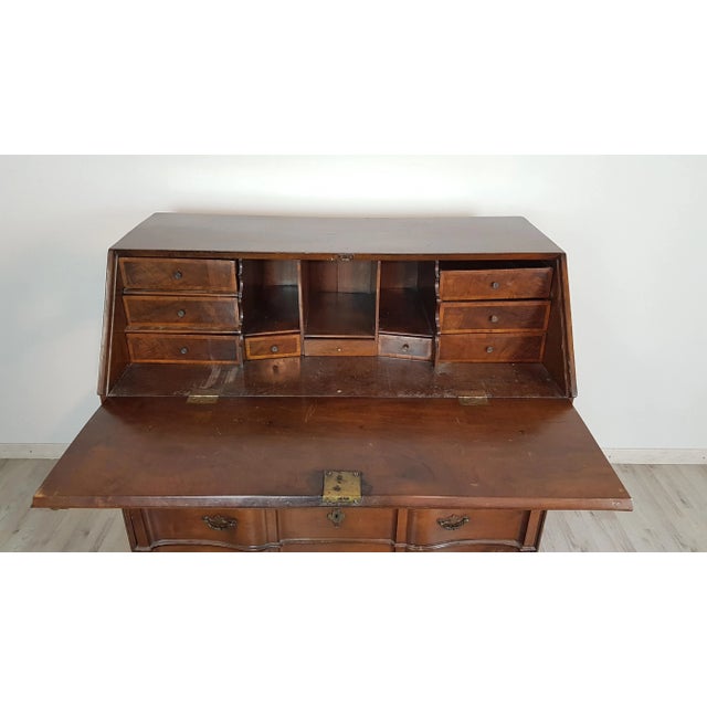 The front of the drawers is made entirely of solid walnut. The chest has a spectacular interior with paved drawers. The...