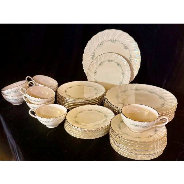 This is a vintage Lenox 40-piece set of dinnerware in the “Musette” pattern, produced between 1961 and 1982. It features...