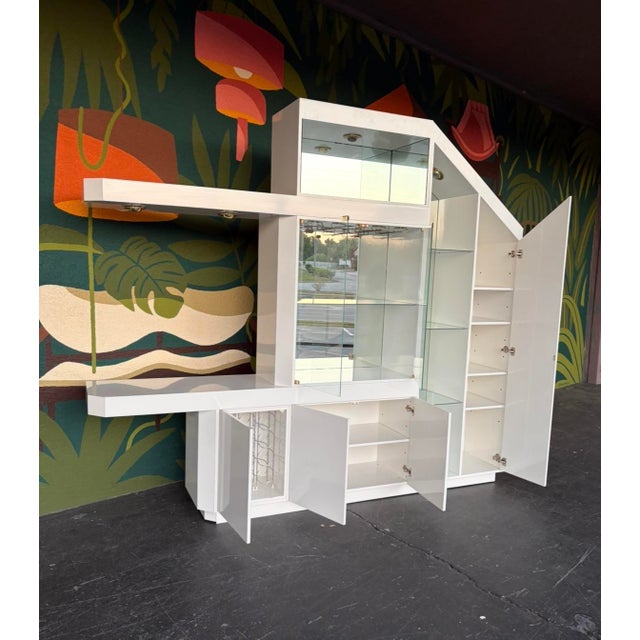 An incredible wall unit/dry bar to take you straight to Miami in the 80s! This came from the original owners, who bought...