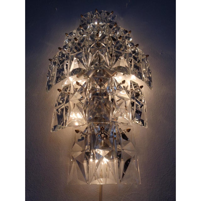 Large Kinkeldey wall lamp from the 1970s. Equipped with 23 prism lenses and 10 light sources. All lenses have been...