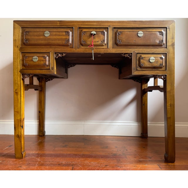 Antique elmwood ming style writing desk with 5 drawers, the top three have locks (two keys included). The desk is carved...