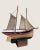 A hand-carved wooden ship model, beautifully aged and worn from time and touch. The linen sails have softened to a natural...
