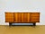 Magnificent sideboard in a modernist, late Art Deco style, made in the 1950s. This slender piece perfectly embodies the...