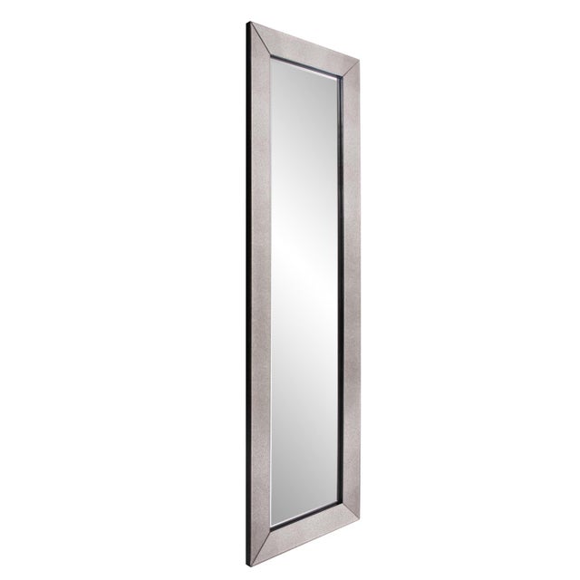 A rich smokey antique mirror covers the outer frame of this simply elegant, beveled mirror. The larger size of version of...