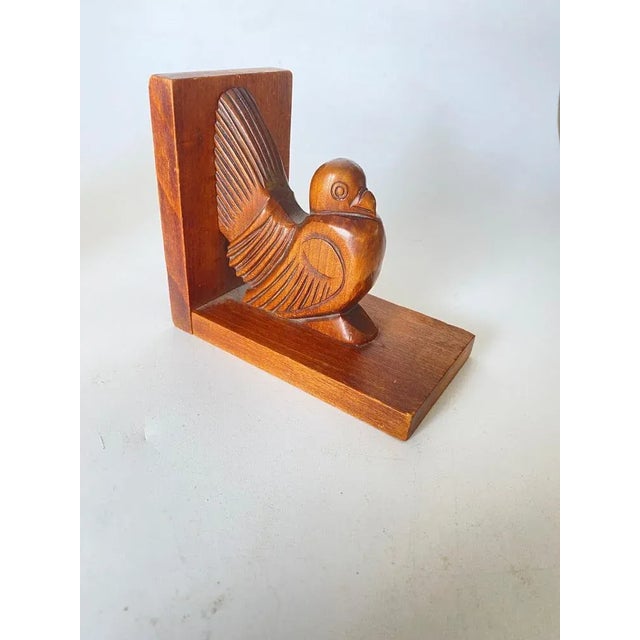 Pair of bookends representing birds. The objects are in wood. These bookends were made in France in the 1940s, they are...