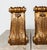 A striking pair of antique carved giltwood architectural corbels, each measuring approximately 18 inches high by 10 inches...
