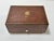 working vintage Reuge Sainte-Croix music box housed in a richly figured burl wood veneer case with brass-tone trim. A...