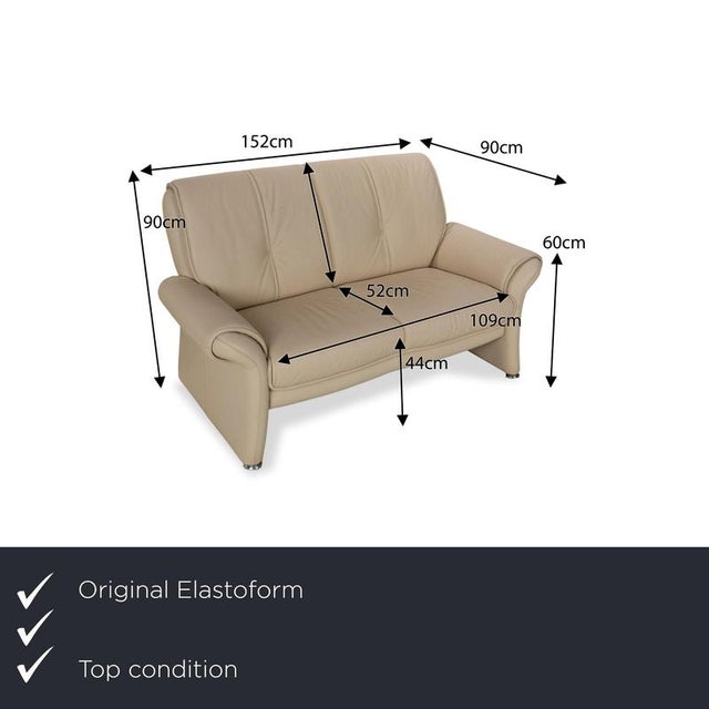 The two-seater from Elastoform is covered in cream-colored genuine leather and comes in a classic design. The slight...