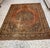 An exceptional antique Persian rug dating to the late 19th century, featuring a richly detailed central medallion set...