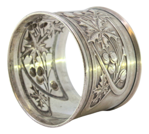 Silver Napkin Ring with Raised Floral Motifs Surrounding a Monogram Card.