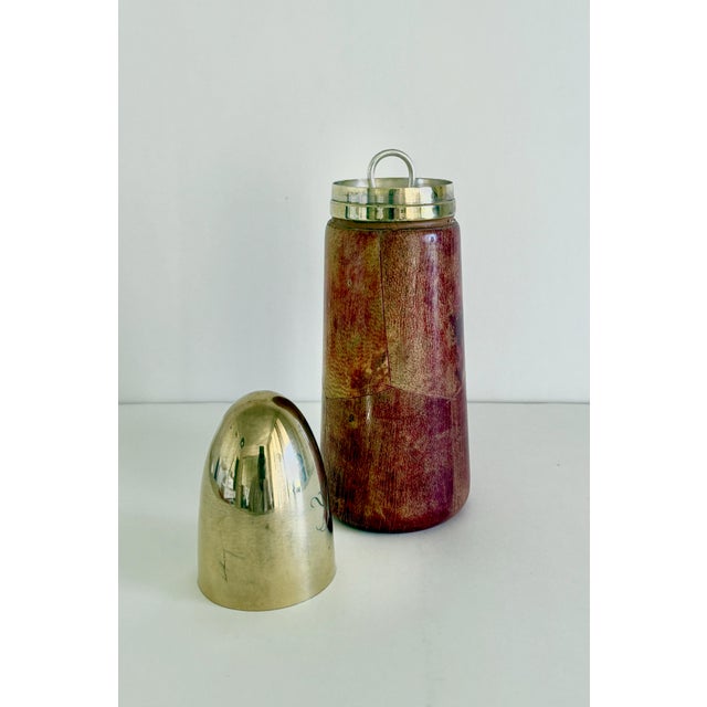 A rare cocktail shaker designed by Aldo Tura and made in Italy for Macabo. The body of the shaker is wood covered with...