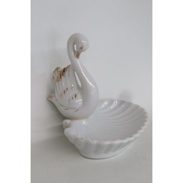 This beautiful Porcelain Trinket Dish is made of porcelain. The bottom of the dish is shaped like a shell with a beautiful...