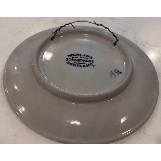 This is a hand painted 9" Highland stoneware plate from Scotland. The plate was made by Highland Stoneware in Ross-Shire,...