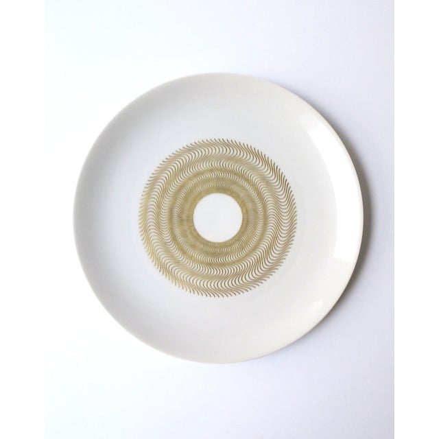 A beautiful set of ten (10) white porcelain, with gold starburst center, dinner plates, French Modernism, designed by...