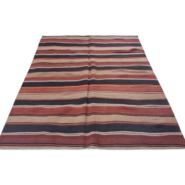 Vintage handwoven decorative kilim rug from Kars region of Turkey. Approximately 50-60 years old. In very good condition.