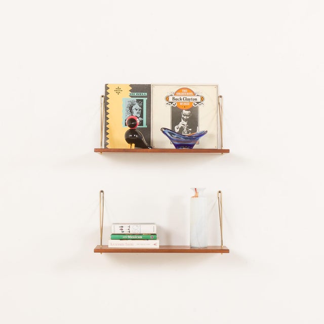 This set of two extra-deep Danish mid-century teak floating shelves, designed in the late 1950s or 1960s, embodies...