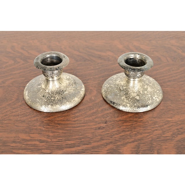 A gorgeous pair of Arts & Crafts period acid silver finished copper candlesticks By Roycroft (signed with impressed orb...