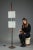 Large floor lamp in teak and black lacquered steel with two diffusers in granite acrylic glass. It rests on a circular...
