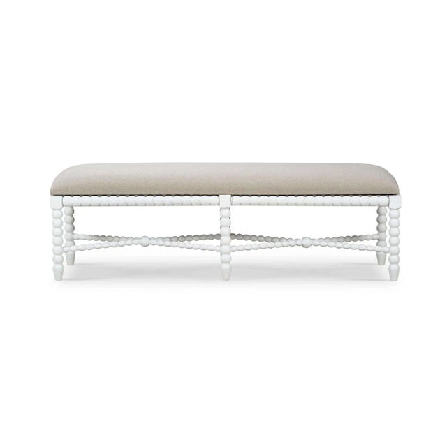 Featuring intricately turned legs in a lightly distressed architectural white painted finish. This bench exudes timeless...