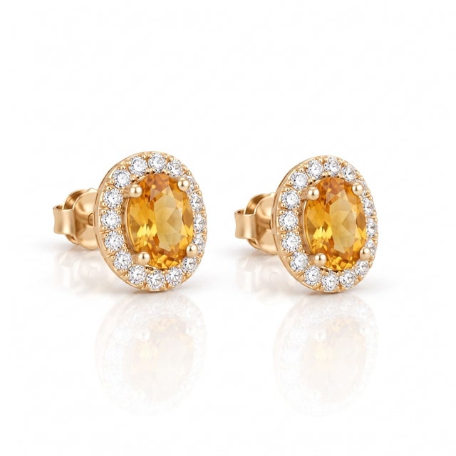 Brighten your style with these radiant citrine oval halo stud earrings, crafted to capture pure warmth and golden...
