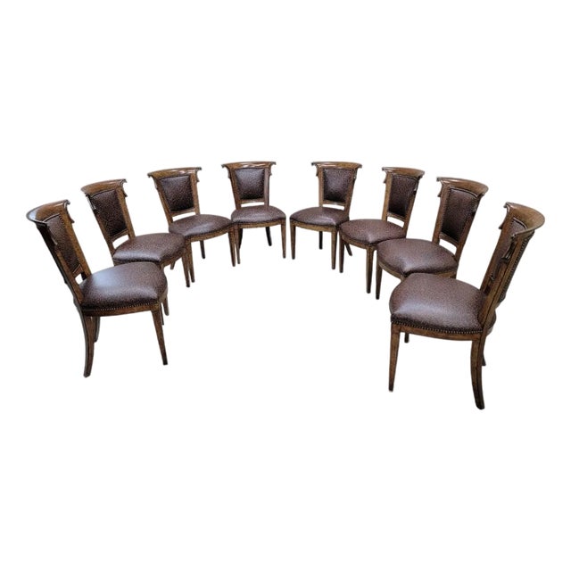 Vintage English Regency Style Ash Wood Dining Chairs Upholstered in a Patterned Brown Leather With Nail Head Trim - Set of 8 For Sale