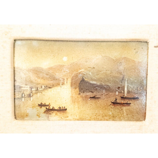 We are selling this small little Italian Alpine lake scene painting. The painting features many boats on a small lake with...