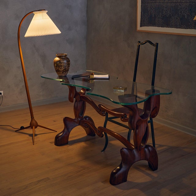 A rare and exceptional console table designed by Paul László in the 1950s. Crafted from richly grained walnut, the...