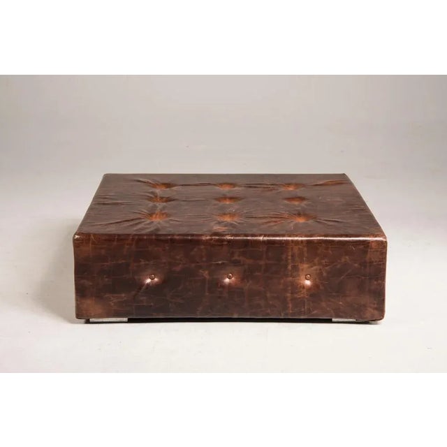 Brown vintage look squared ottoman Size to be confirmed: 120 x 120 cm H 40 cm.