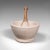 This is an antique mortar and pestle. An English, ceramic and beech apothecary or cookery tool by Wedgwood, dating to the...