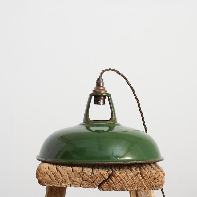 An early english factory shade by ‘coolicon’ salvaged from an old factory. The shade is green in colour and vitreous...