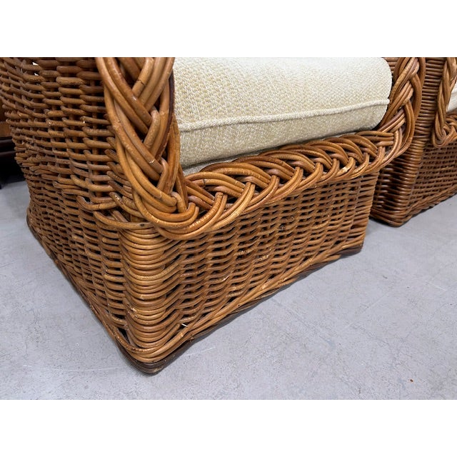 Large pair of vintage rattan braided wicker lounge chairs to float in your space. Upholster the interior backs for a...