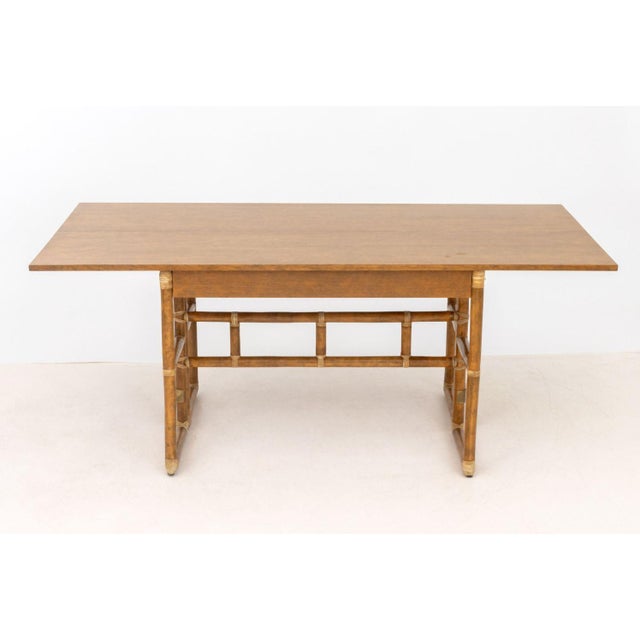 Lyda Levi for McGuire Company Gate Leg Console Table, the rectangular oak wood flip-top above bamboo and rattan base....
