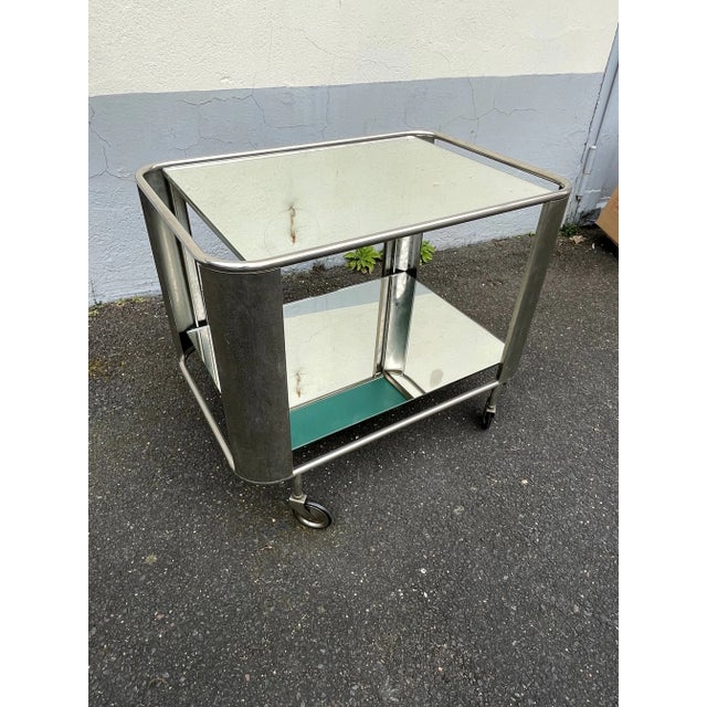 Elegant nickel-plated Art Deco bar cart/serving trolley. France, 1930s. The two mirrored panels have been replaced by a...