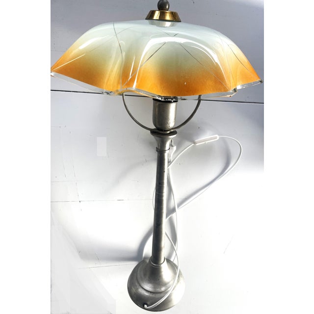A unique vintage table lamp with an amber glass shade, ikea model b9512, dating from the 1960s–1990s. this elegant and...