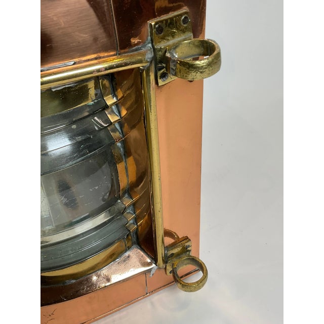 Beautiful polished copper ships masthead lantern with glass fresnel lens, original burner, hinged door, etc. Brass...