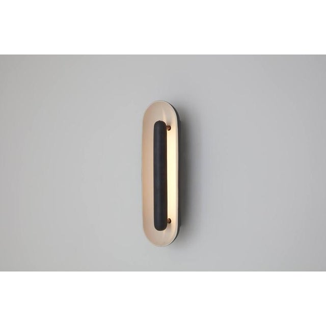 Oblong cosmos ceramic wall lamp by jennifer midoz dimensions: d 9,5 x w 10 x h 33 cm materials: glazed ceramic, pale gold...