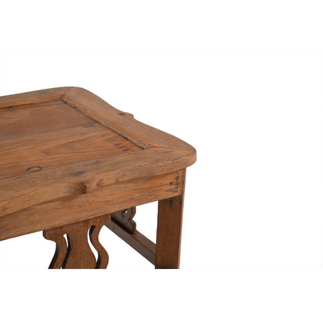 This Vintage Indian Teakwood Side Table is constructed from solid teakwood, featuring a tray-style top, decorative...