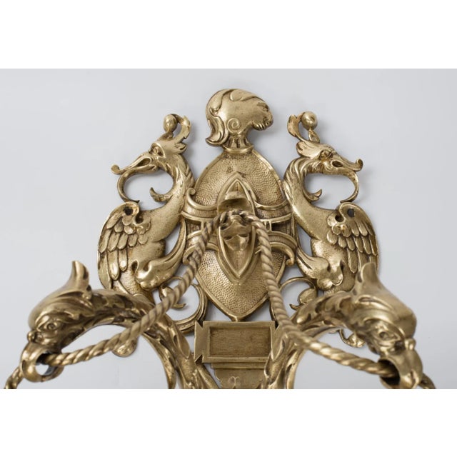 A large vintage solid cast brass 2-light wall sconce with figural dragons, holding hand-cut glass shades. Rare piece of...